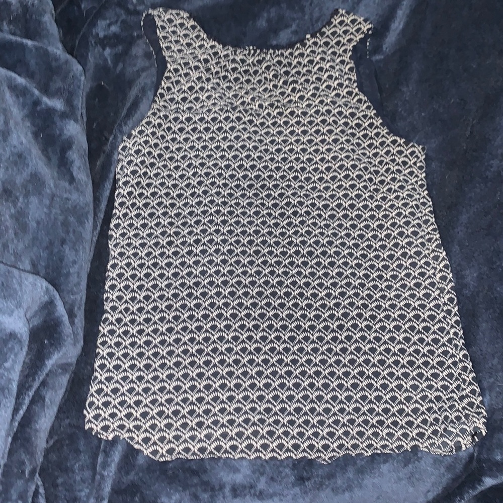 It is a navy blue shirt, from the brand H&M, size 4.